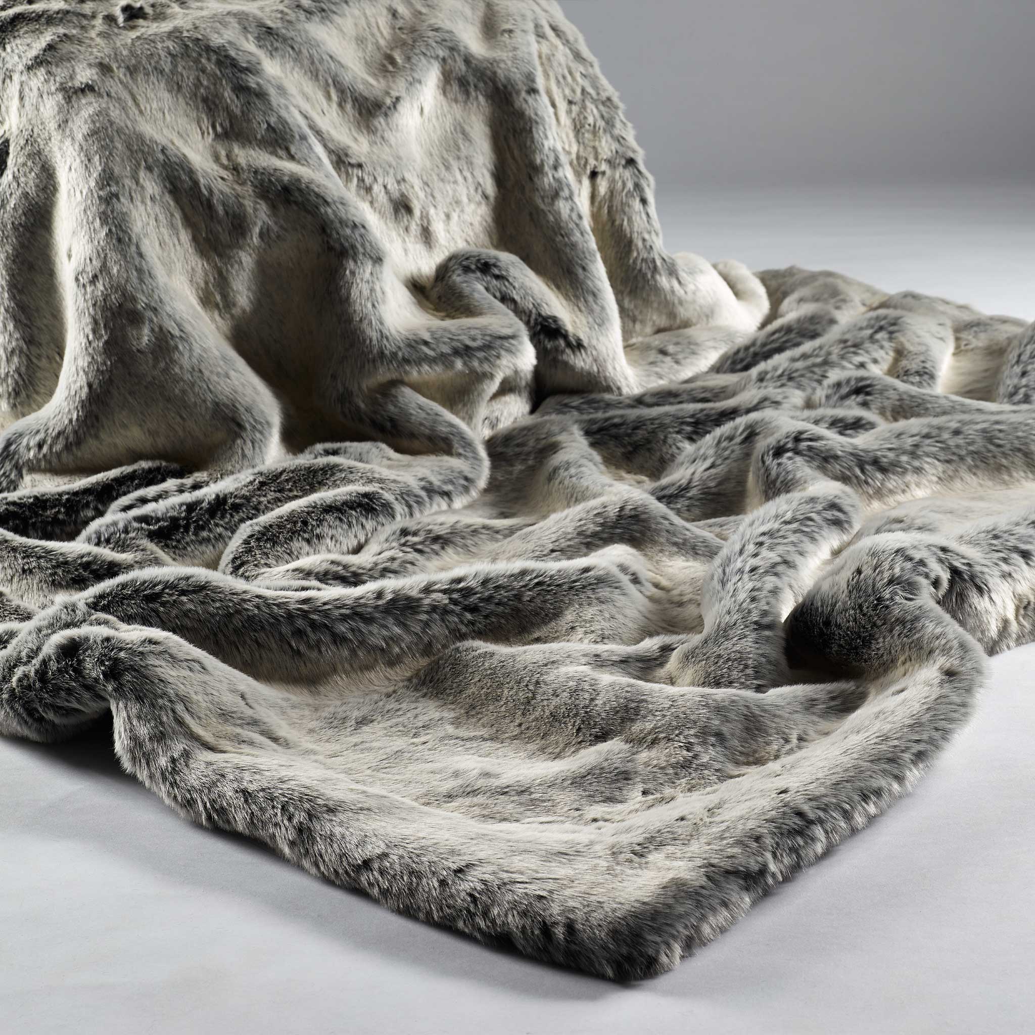 Luxury throw, in super soft faux fur in Alaska grey colour,  with matching soft imitation suede to the reverse. One of two sizes in this colour range, Small. 
Dimensions: 1400 x 1800 mm 
Delivery: 4-6 days