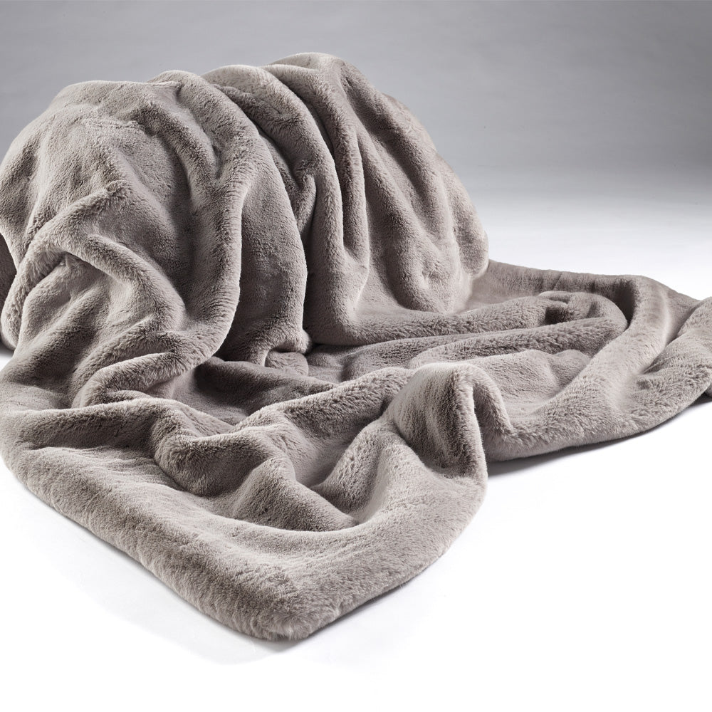 Luxury throw, in super soft faux fur in putty grey colour, with matching soft imitation suede to the reverse. One of two sizes in this colour range, Large. Dimensions: 1400 x 2400 mm Delivery: 4-6 days