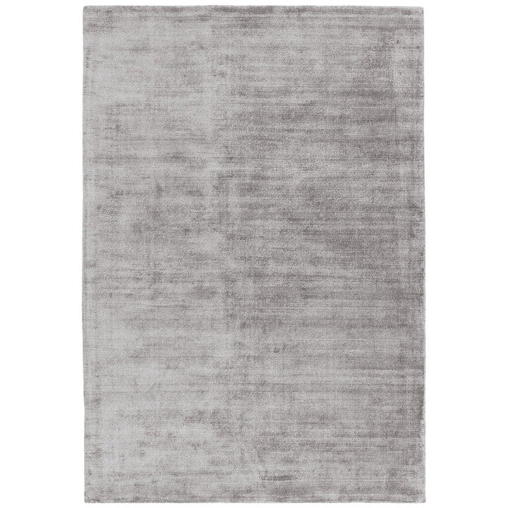 Luxury handwoven viscose rug, in silver colour, with a tip sheared finish giving a vintage effect. Size - Extra Large   Pile Height: 7mm   Dimensions: 2400 x 3400 mm    100% Viscose   Hand Woven in India   Delivery: 5-7 days