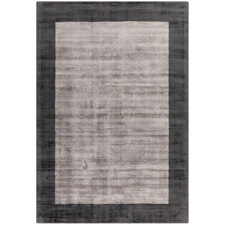 Luxury handwoven viscose rug, in silver with a wide charcoal boarder, with a tip sheared finish giving a vintage effect. Size - Large   Pile Height: 7mm   Dimensions: 2000 x 2900 mm  100% Viscose   Hand Woven in India  Delivery: 5-7 days