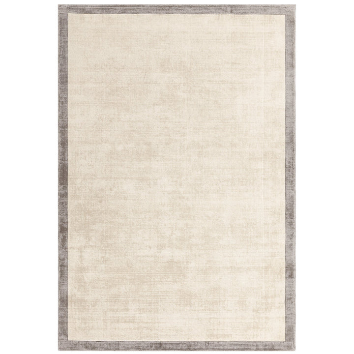 Luxury handwoven viscose rug, in putty with a narrow silver boarder, with a tip sheared finish giving a vintage effect. Size - Large   Pile Height: 7mm   Dimensions: 2000 x 2900 mm  100% Viscose   Hand Woven in India  Delivery: 5-7 days