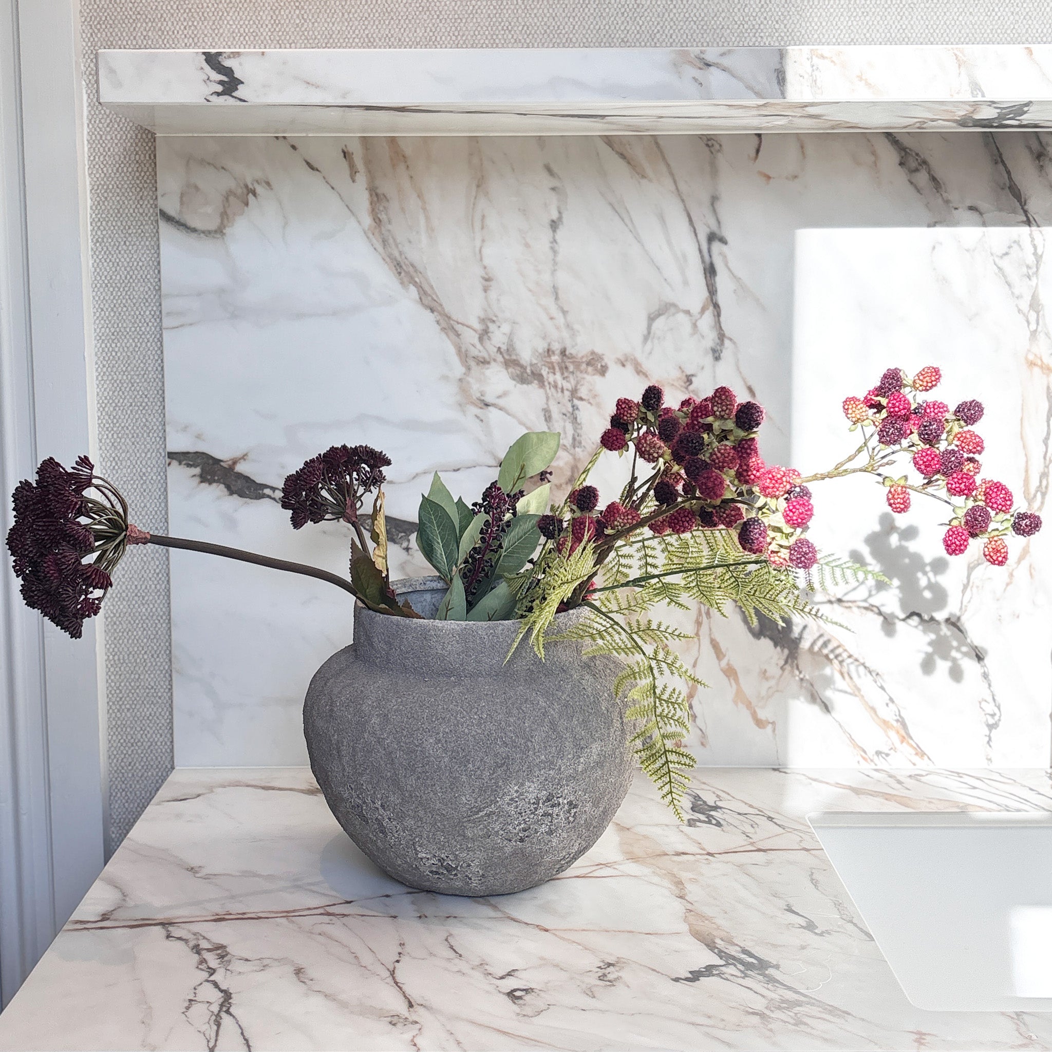A moody, romantic display centred on deep burgundy blooms, gathered with clusters of plum and raspberry-pink mulberries and soft, trailing fern. Overall Height: 40cm, Overall Width: 70cm, Delivery is 2-10 working days, depending on stock availability