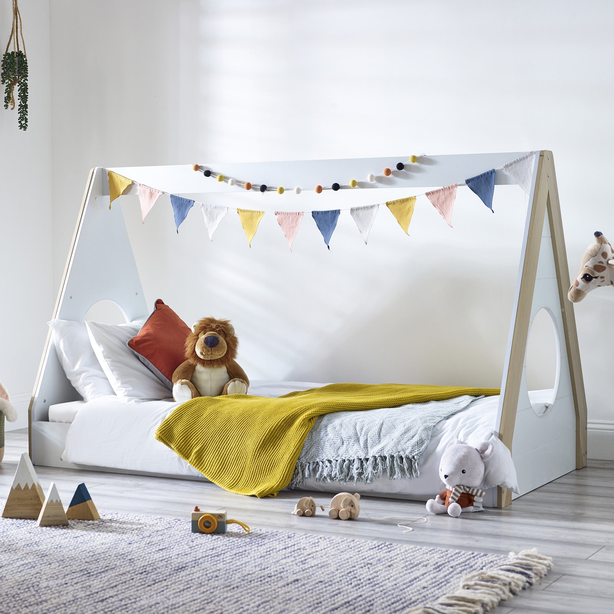 Festival Tent Low Sleeper, this teepee-style bed, with a charming, white and wood finish. The bed features a unique circle detail at the end.  Designed with safety and comfort in mind, the low sleeper style ensures easy access for little ones.                                                                                                                                                                                       Dimensions: D:199 W:96 H:121cm