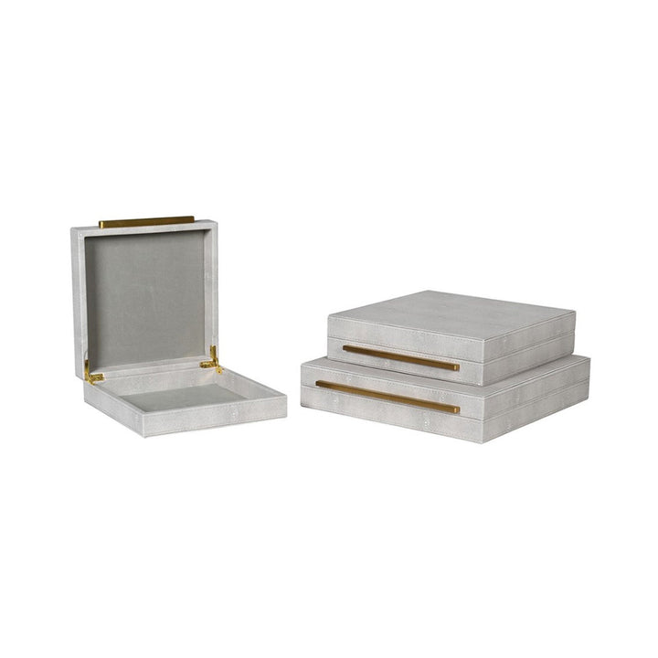 Set of 3 faux shagreen boxes in an ivory tone. All have a gold bar handle across the front opening 
Dimensions: Large Box H:80 W:350 D:350 mm 
Medium Box: H:80 W:300 D:300mm.
Small Box: H:80 W:250 D:250mm.